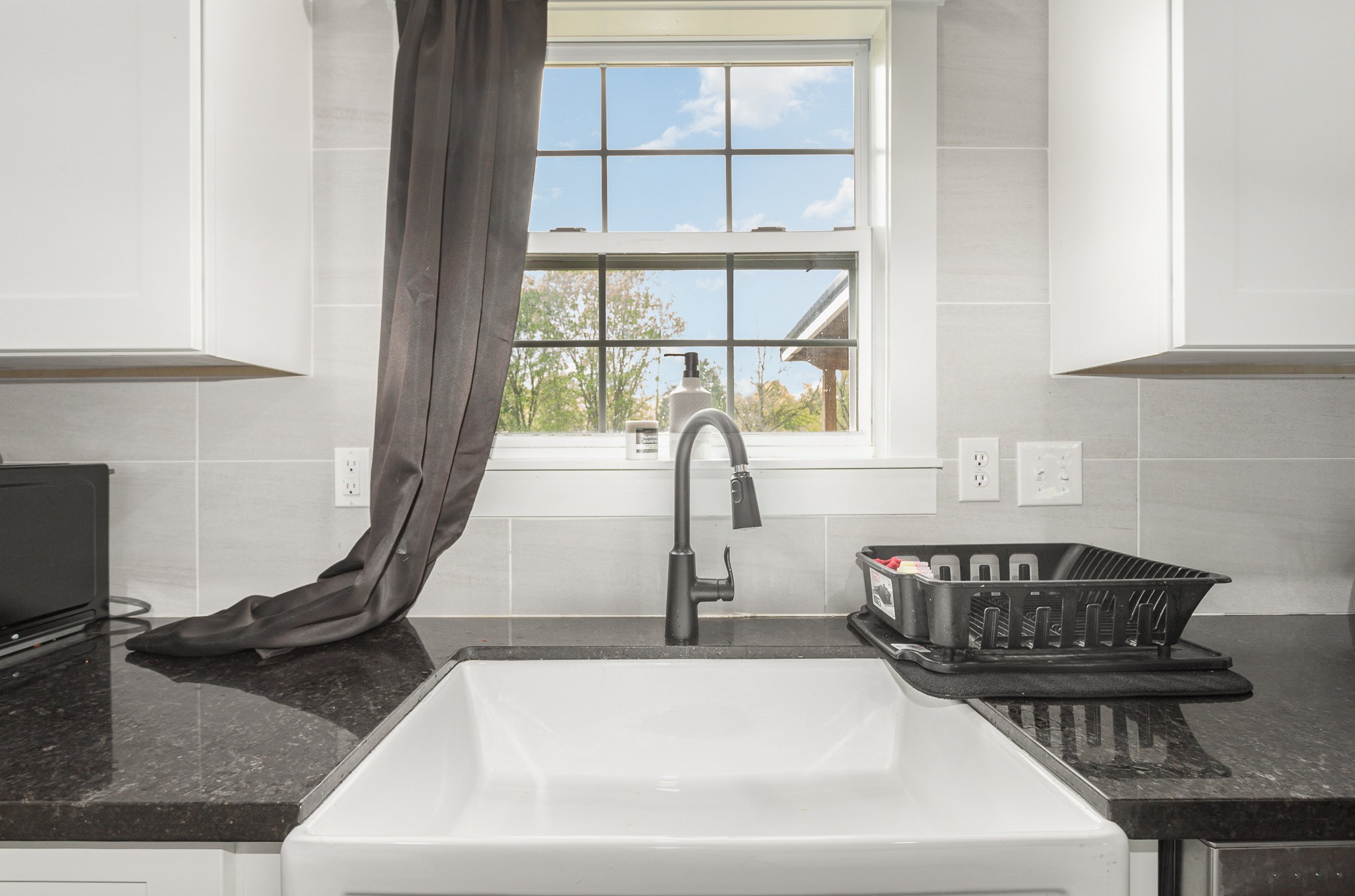 7953 Spot Light Road Lyles, TN 37098 - Photo 9 of 19 a bathroom with a sink and a window