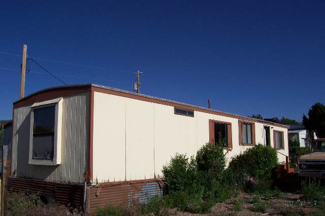 1163 Dale Street Eagar, AZ 85925 - Photo 1 of 5 a front view of a house with garden