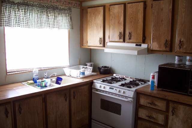 1163 Dale Street Eagar, AZ 85925 - Photo 4 of 5 a kitchen with appliances cabinets and a window