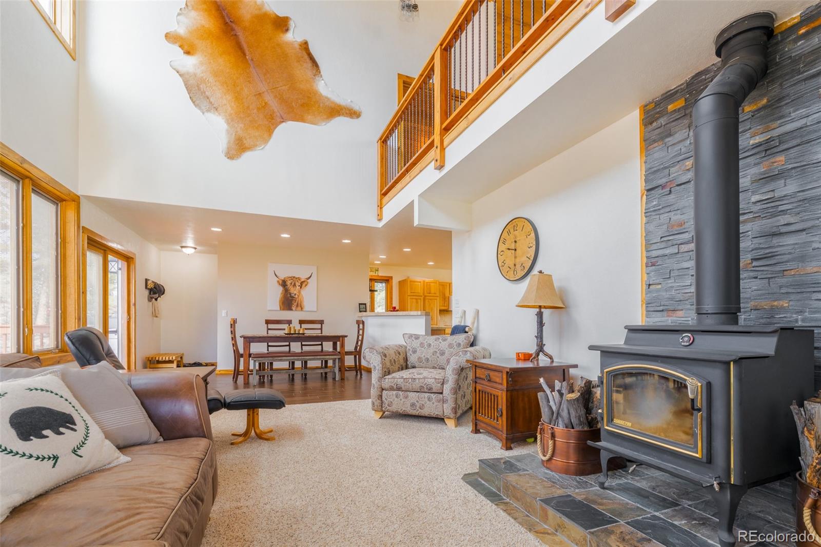 8221 Remington Road Como, CO 80432 - Photo 14 of 49 a living room with furniture and a fireplace