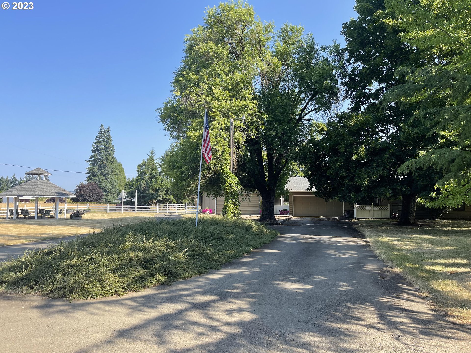 1320 North Fir Villa Road Dallas, OR 97338 - Photo 1 of 31 a view of a tree in a yard