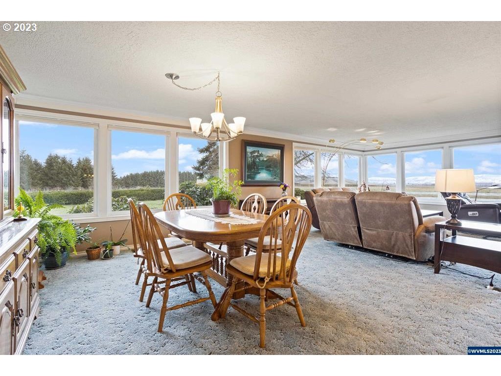 1320 North Fir Villa Road Dallas, OR 97338 - Photo 6 of 31 a view of a dining room with furniture window and outside view