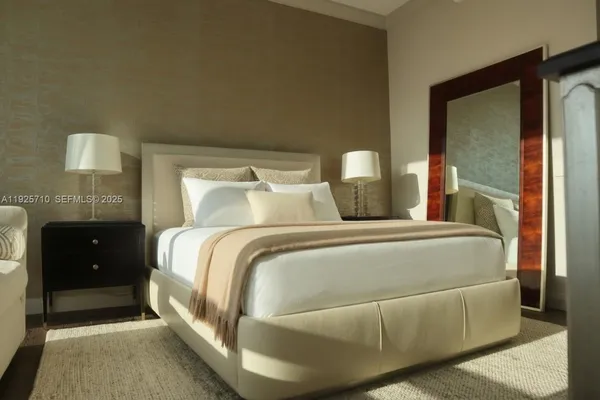 a bedroom with a bed and a closet