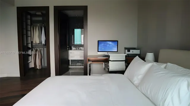 a living room with furniture and a mirror