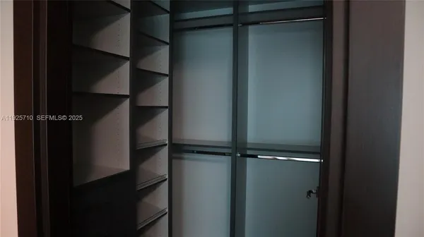 a bathroom with a double vanity sink mirror and shower