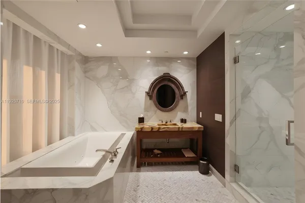 a spacious bedroom with a bed and large window
