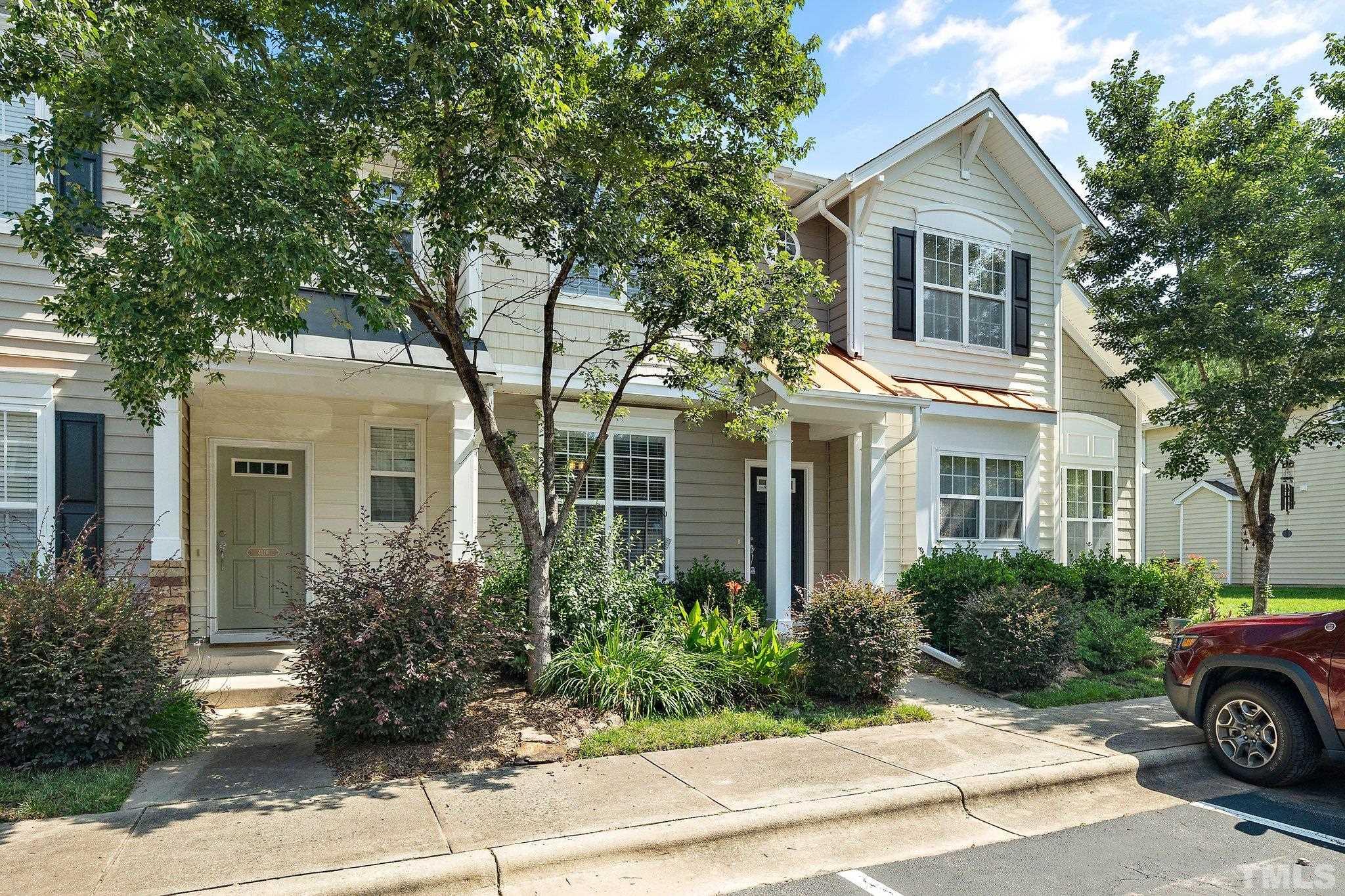 a view of house and a yard