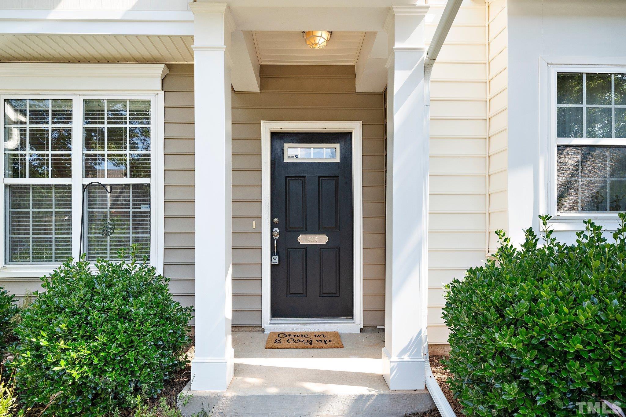 4114 Brenmar Lane Durham, NC 27713 - Photo 2 of 13 a view of front door and potted plants
