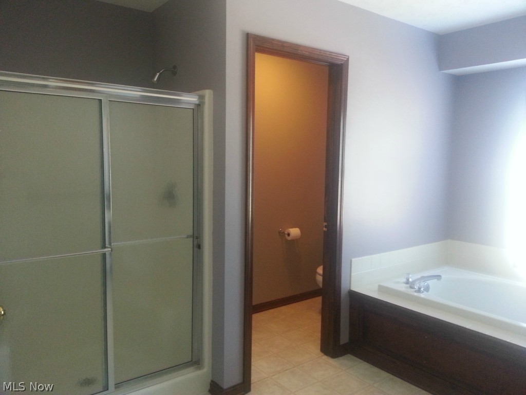 696 Winesap Road Amherst, OH 44001 - Photo 13 of 25 Master bath with shower and tub