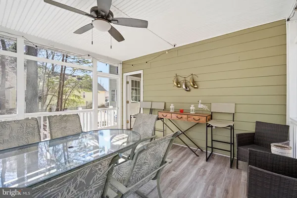 a view of a livingroom with furniture and a window