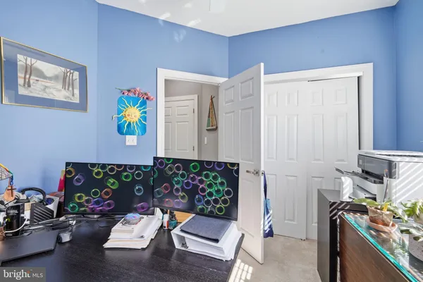 a bathroom with a sink a toilet and shower curtain