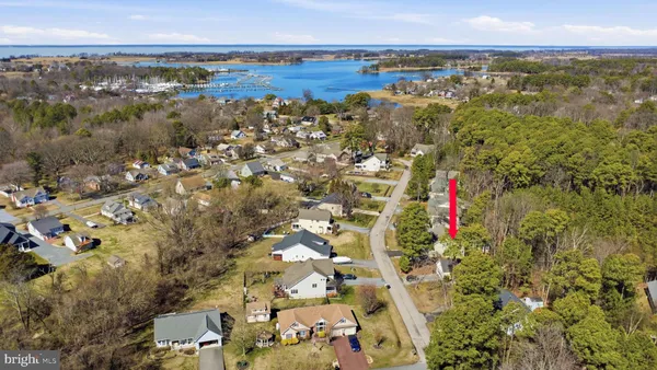 an aerial view of a house with a yard basket ball court