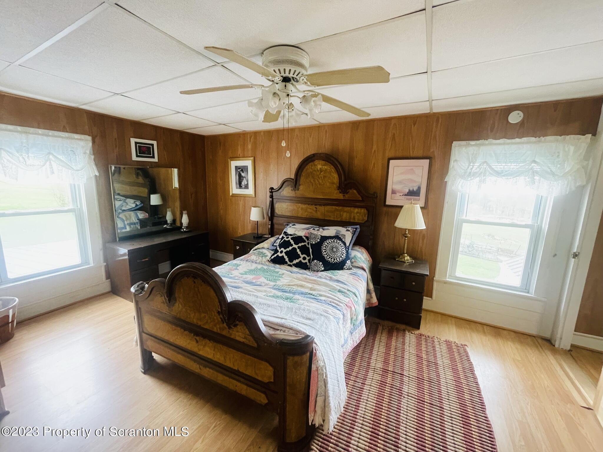 176 Stack Road Thompson, PA 18465 - Photo 11 of 53 a bedroom with bed and window