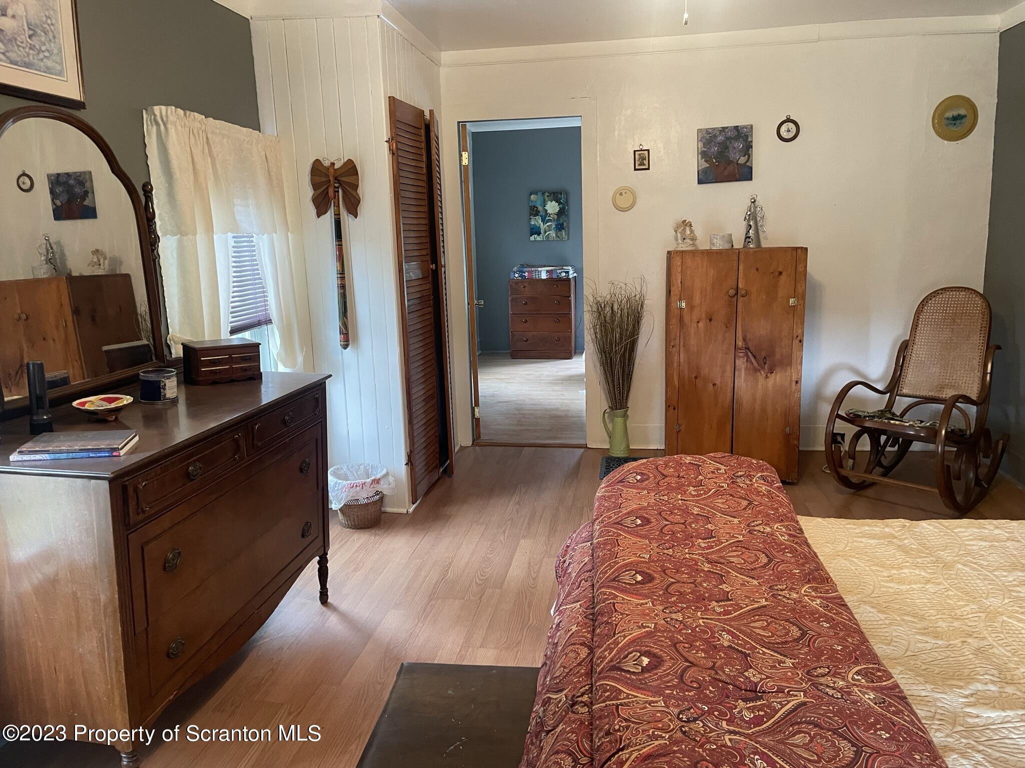 176 Stack Road Thompson, PA 18465 - Photo 19 of 53 a bed room with a bed and a television