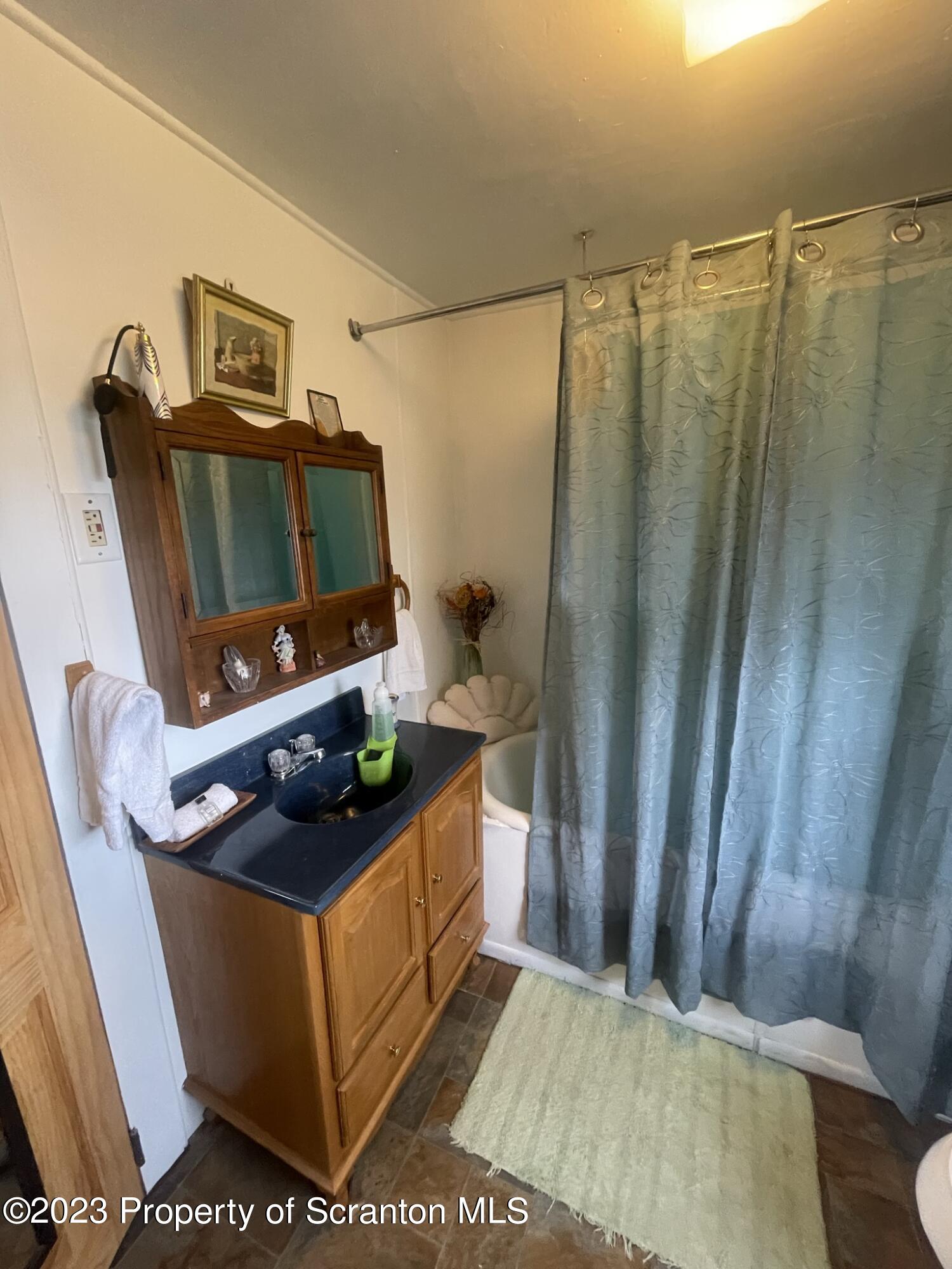 176 Stack Road Thompson, PA 18465 - Photo 24 of 53 a living room with furniture