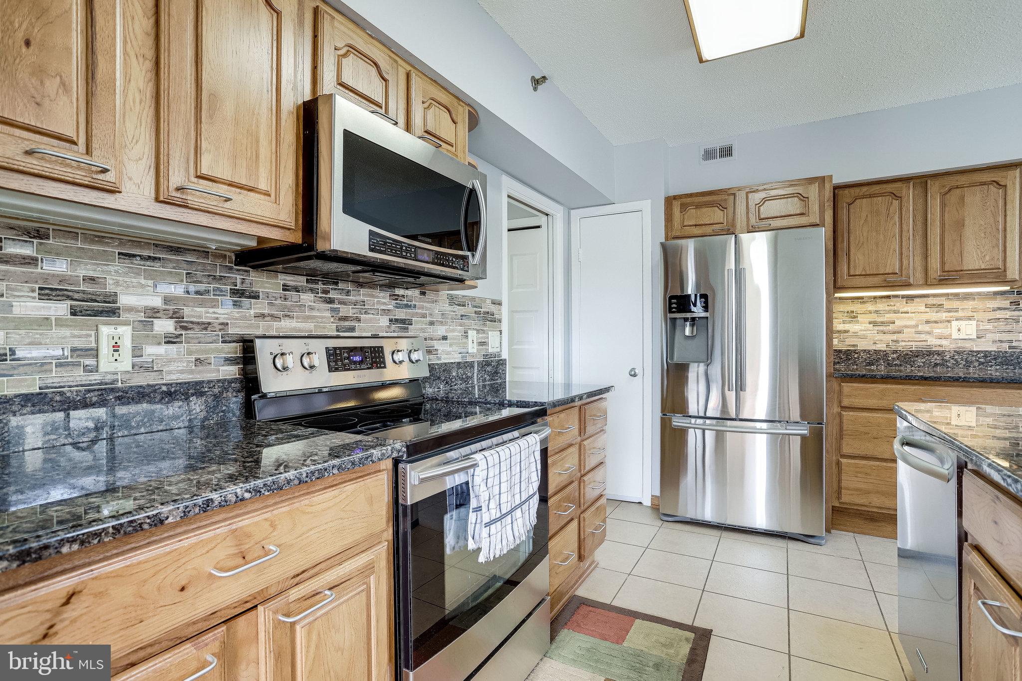 5501 Seminary Road, Unit 105S Falls Church, VA 22041 - Photo 1 of 34 Wood Kitchen cabinets w/ granite c/tops