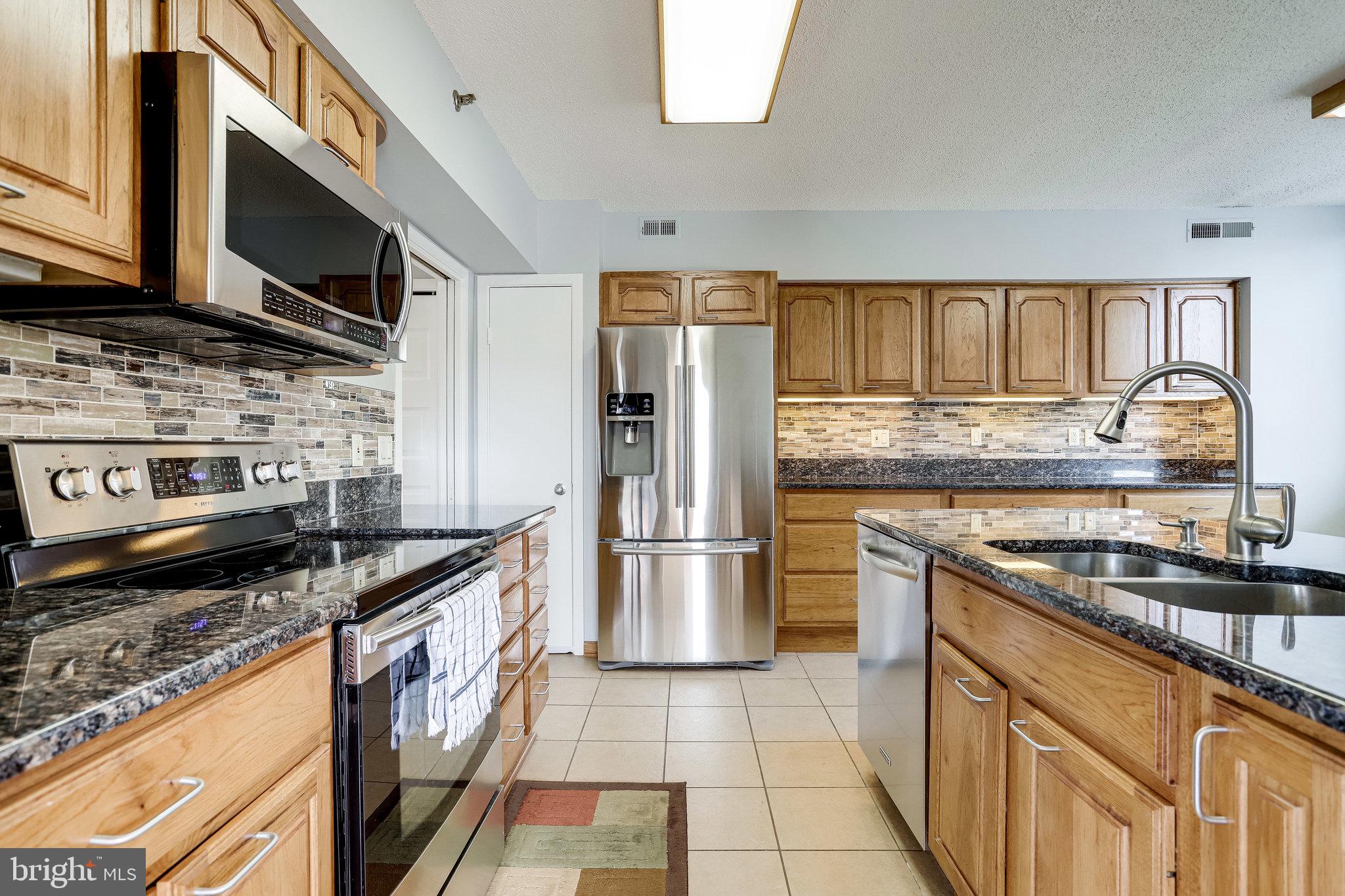 5501 Seminary Road, Unit 105S Falls Church, VA 22041 - Photo 2 of 34 Top of the line 'Samsung' SS kitchen appliances
