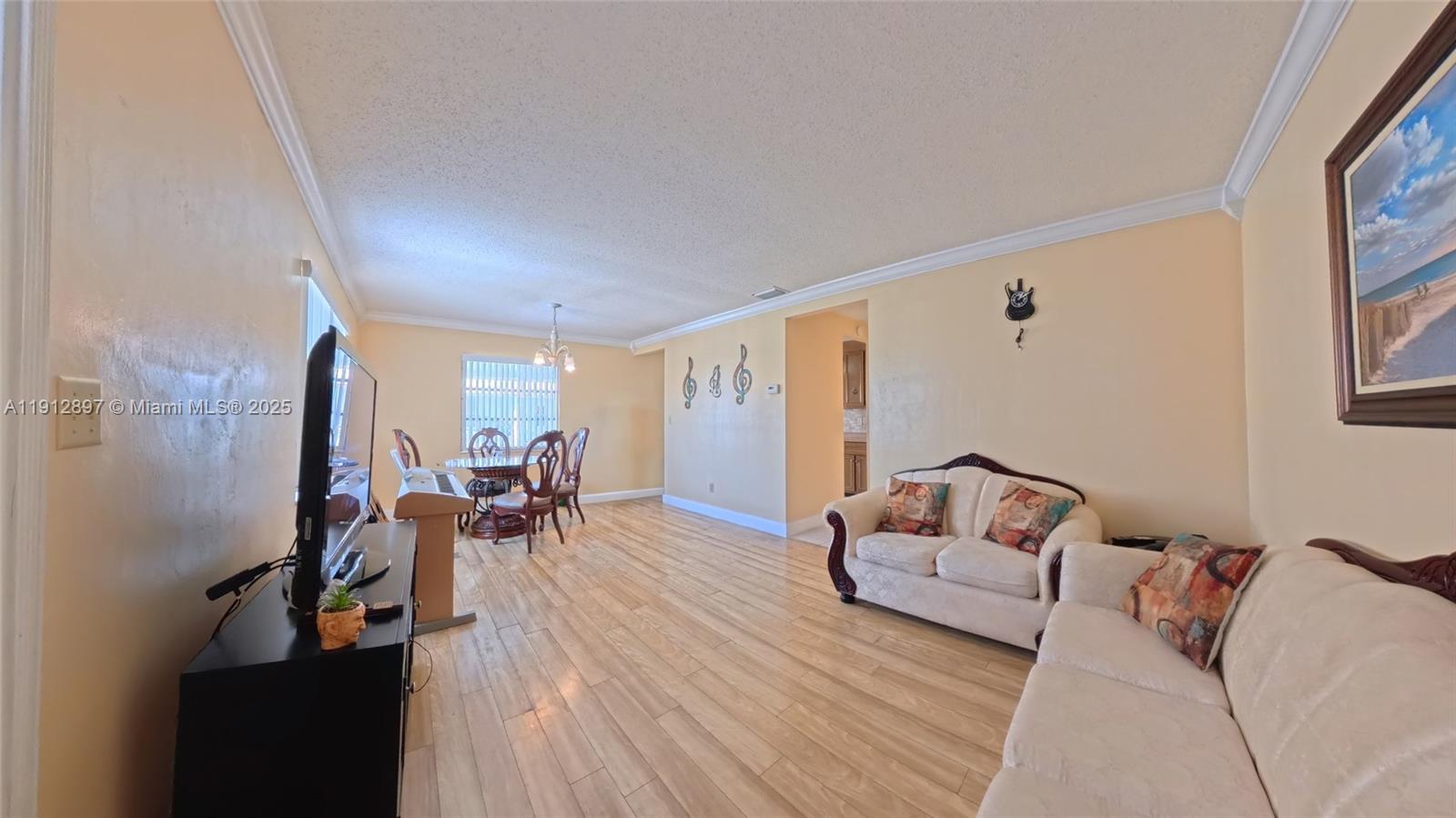 10 Dawn Flower Circle Lehigh Acres, FL 33936 - Photo 14 of 25 a living room with furniture and wooden floor