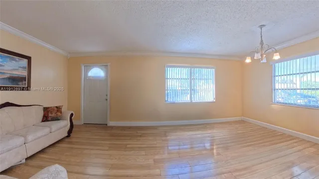 a view of livingroom with furniture and window