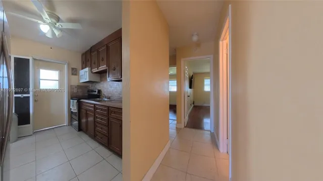 a view of a kitchen from the hallway