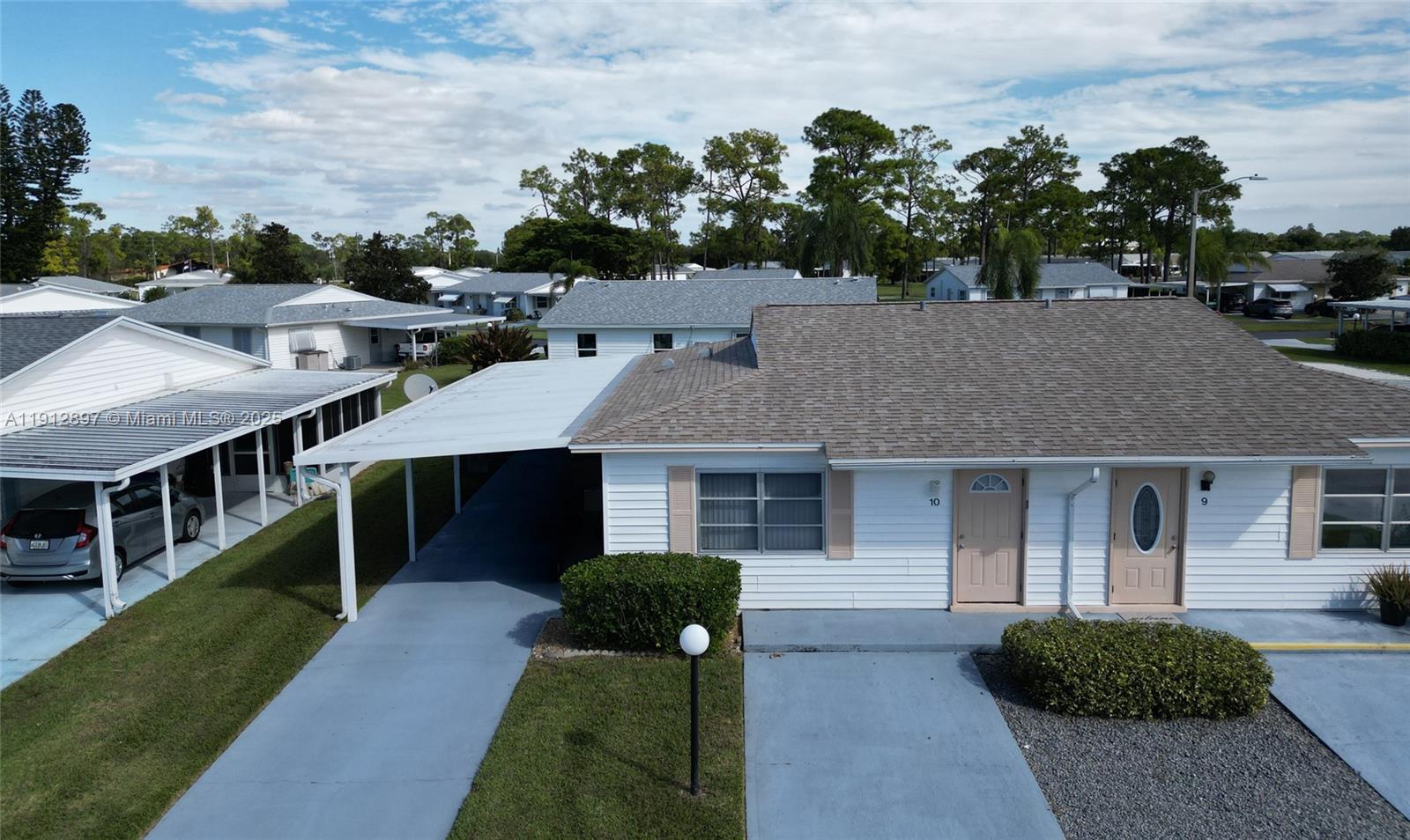 10 Dawn Flower Circle Lehigh Acres, FL 33936 - Photo 2 of 25 a front view of a house with garden