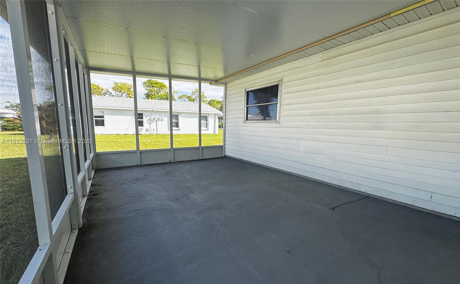 10 Dawn Flower Circle Lehigh Acres, FL 33936 - Photo 10 of 25 a view of an empty room and window