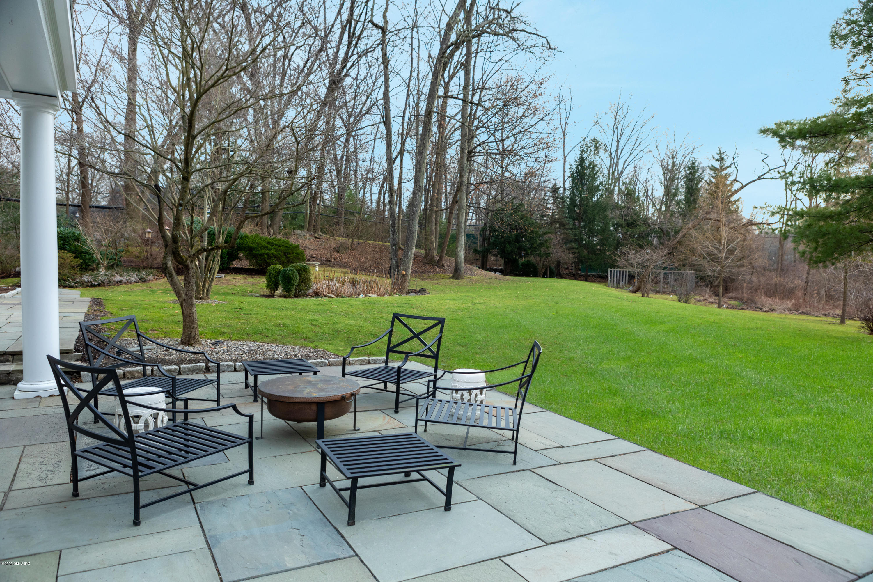 19 Dingletown Road Greenwich, CT 06830 - Photo 17 of 20 a view of a chairs and table in backyard of the house
