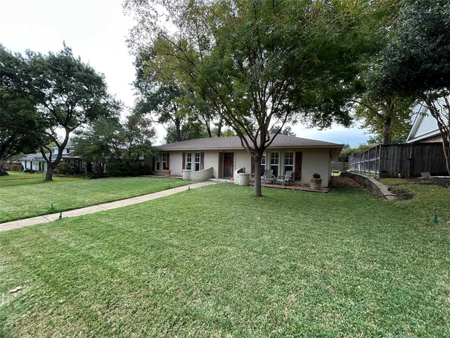 a view of a house with a yard porch and sitting area