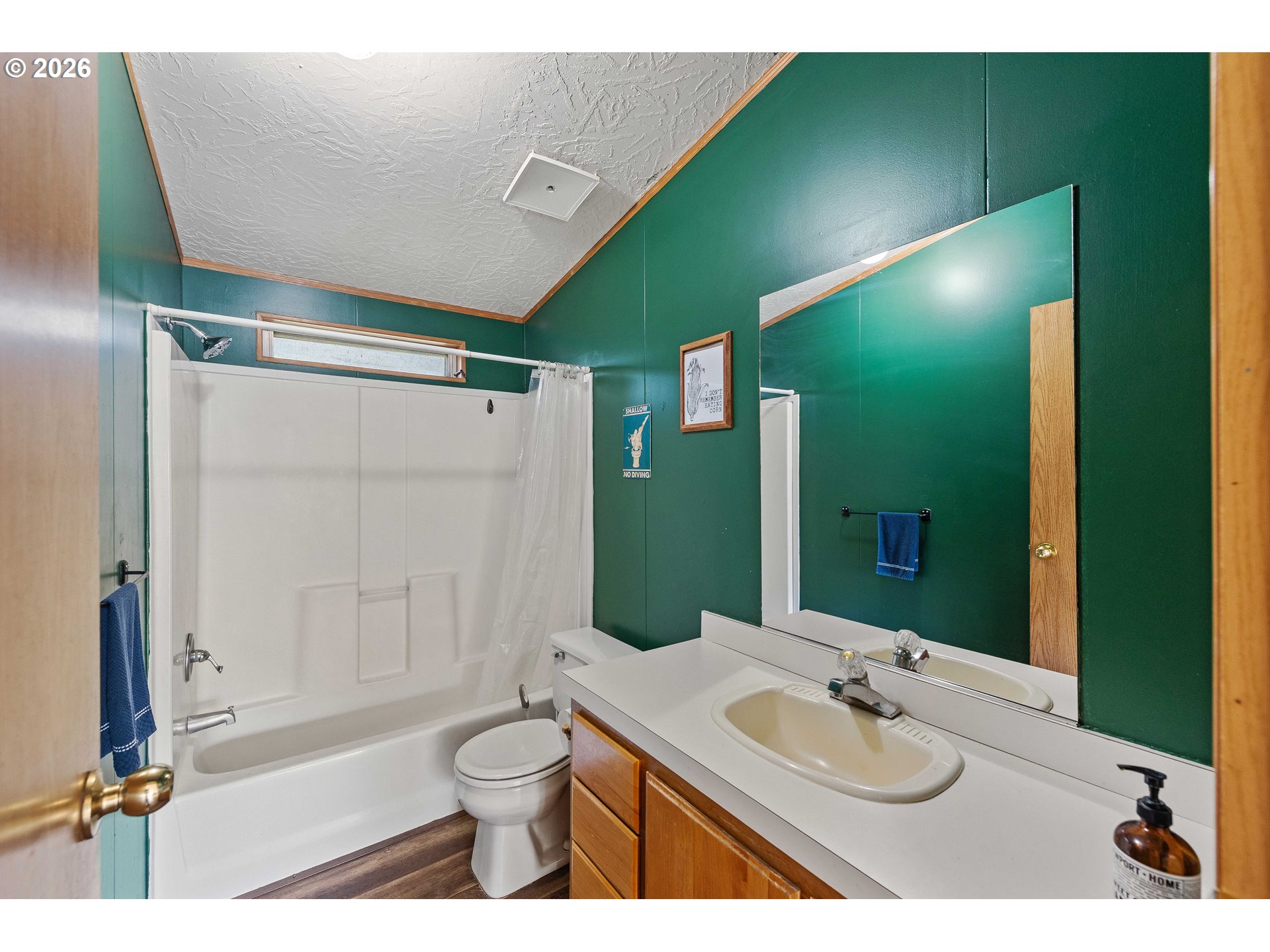 41308 South Powers Road Powers, OR 97466 - Photo 12 of 42 a bathroom with a granite countertop sink toilet and shower