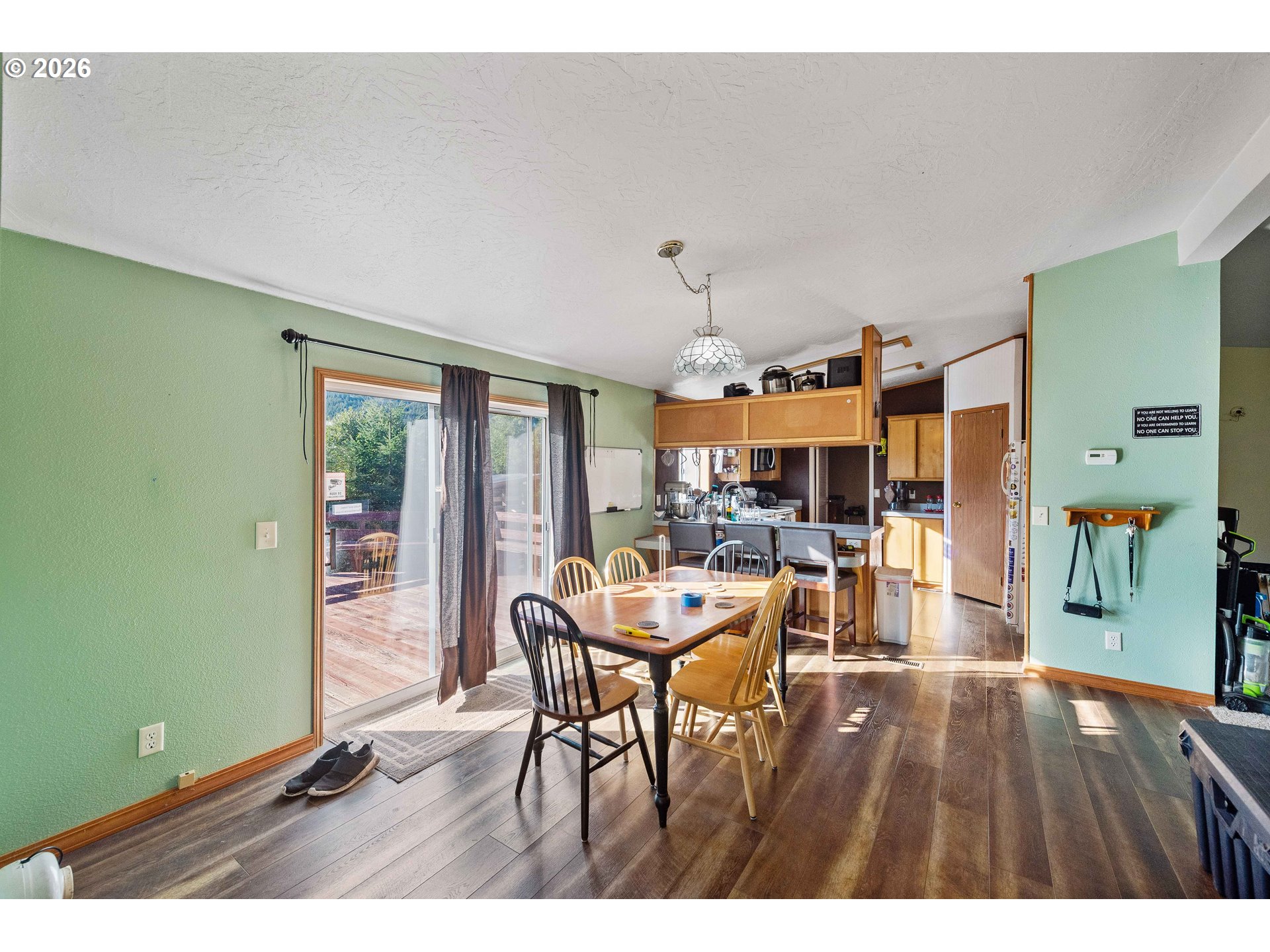 41308 South Powers Road Powers, OR 97466 - Photo 13 of 42 a living room with furniture and a large window