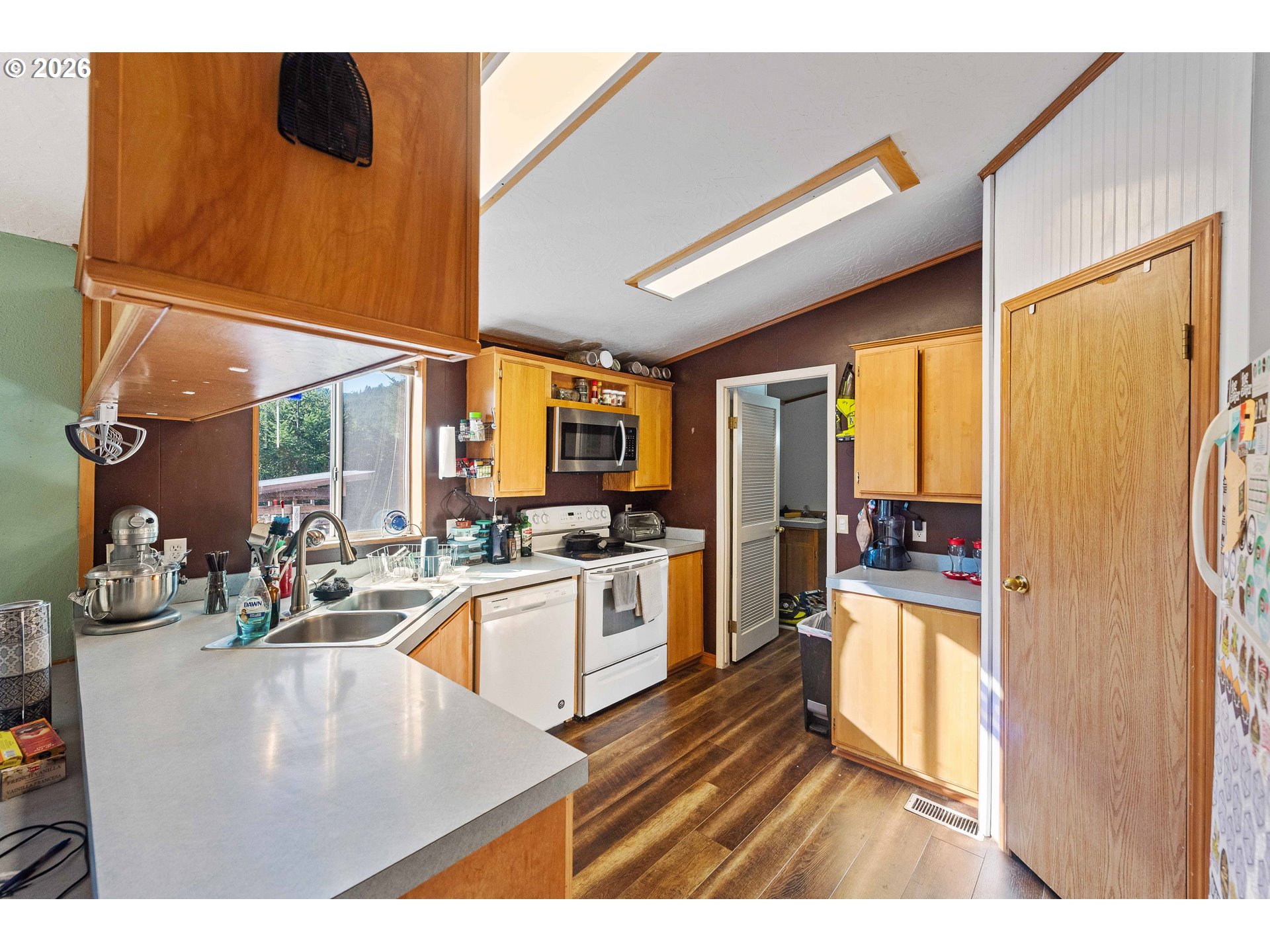 41308 South Powers Road Powers, OR 97466 - Photo 14 of 42 a kitchen with sink and refrigerator
