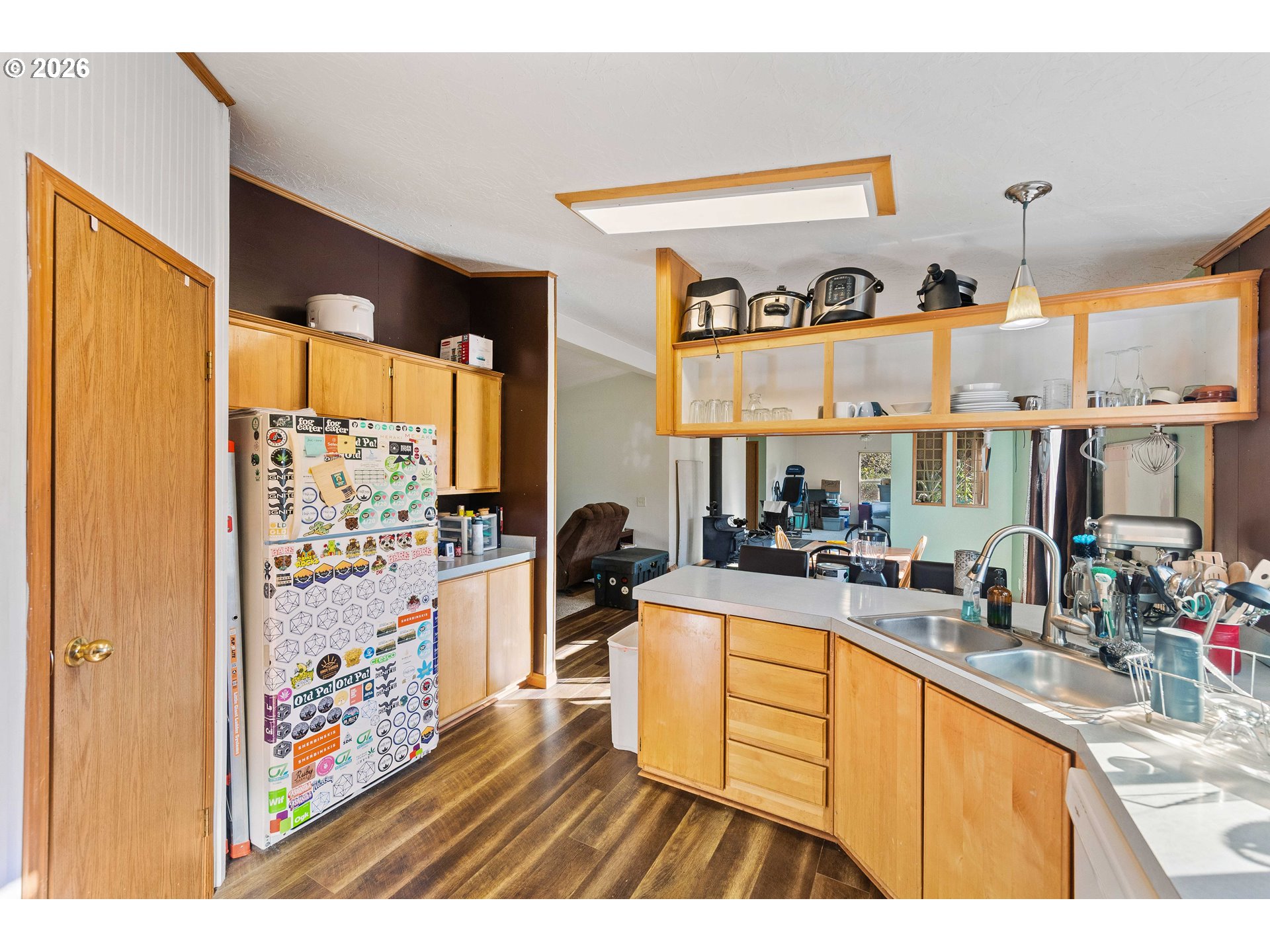 41308 South Powers Road Powers, OR 97466 - Photo 16 of 42 a kitchen with stainless steel appliances granite countertop a refrigerator and a stove top oven