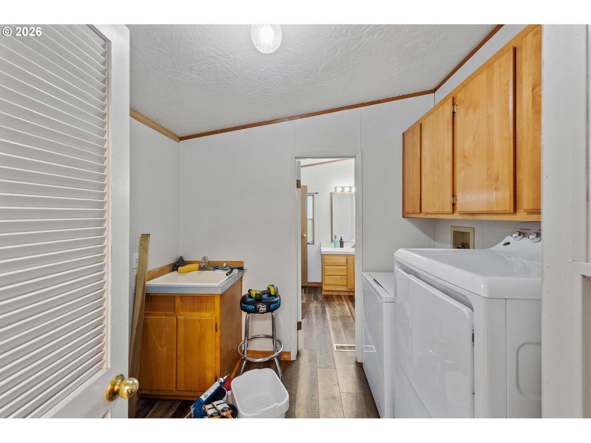 41308 South Powers Road Powers, OR 97466 - Photo 17 of 42 a bathroom with a sink a mirror and a bathtub