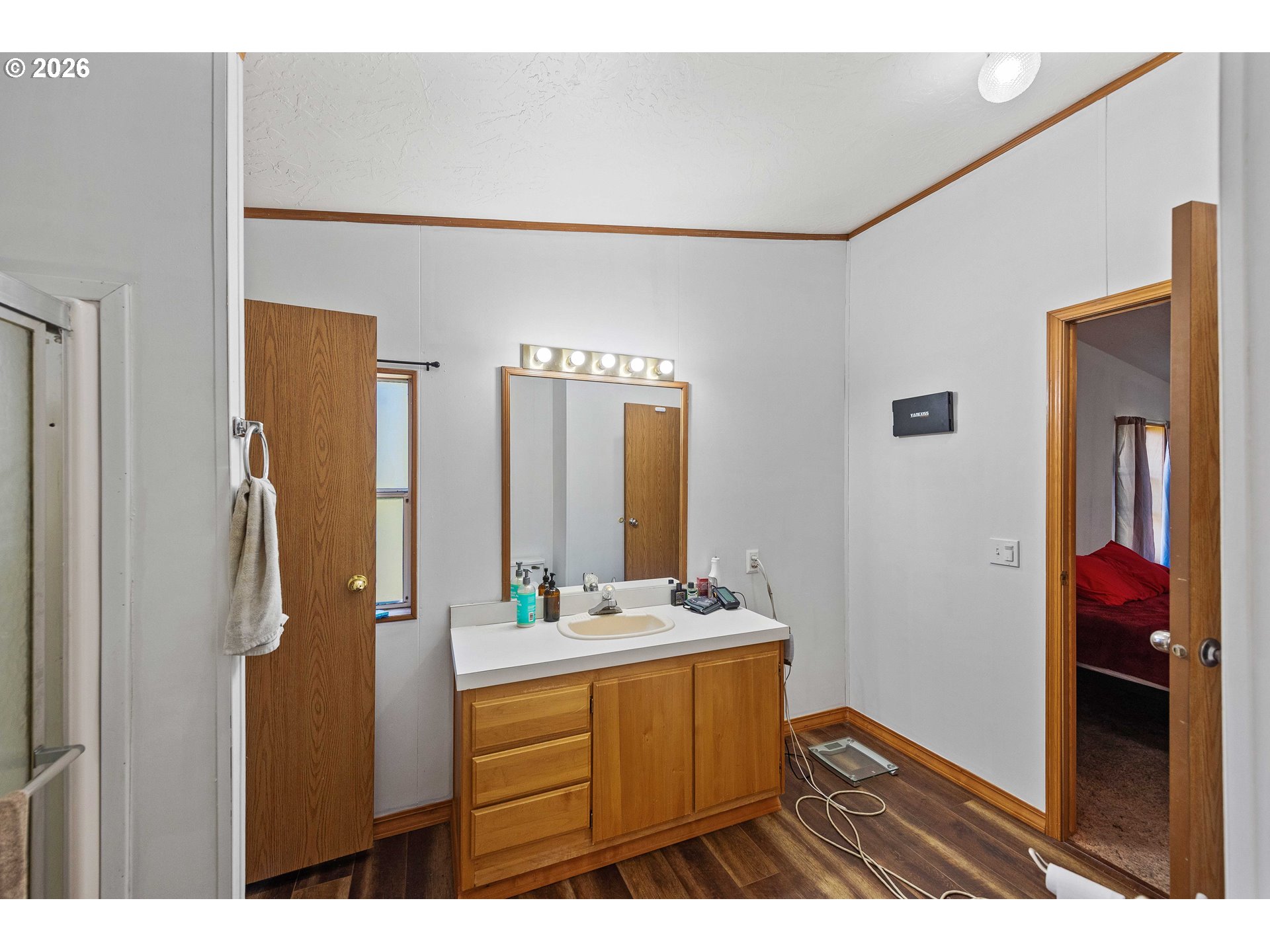 41308 South Powers Road Powers, OR 97466 - Photo 22 of 42 a bathroom with a sink mirror and vanity