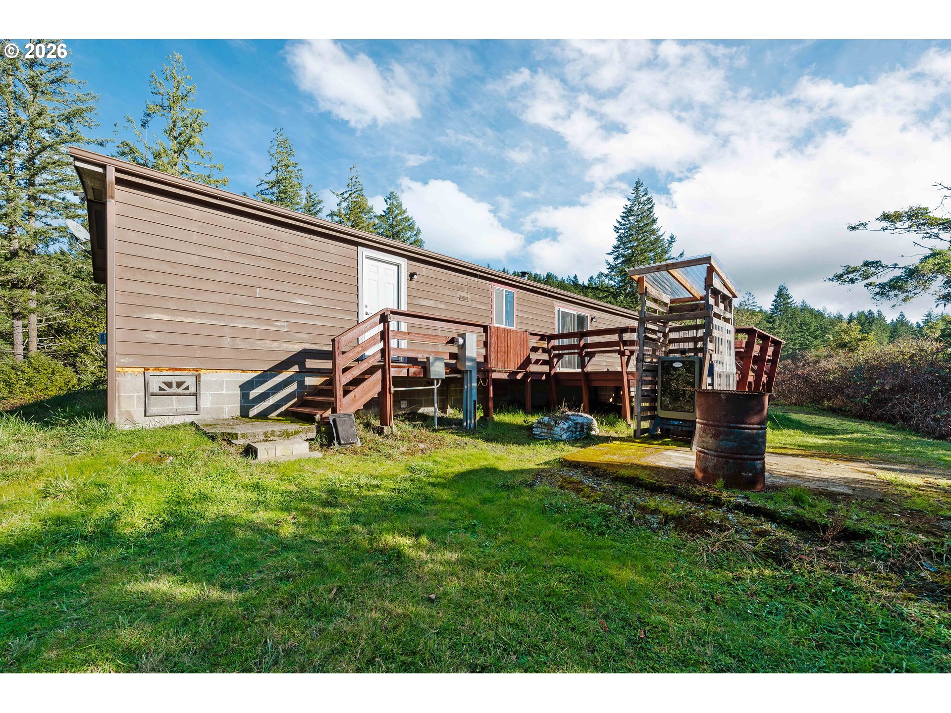 41308 South Powers Road Powers, OR 97466 - Photo 26 of 42 a view of a house with a yard
