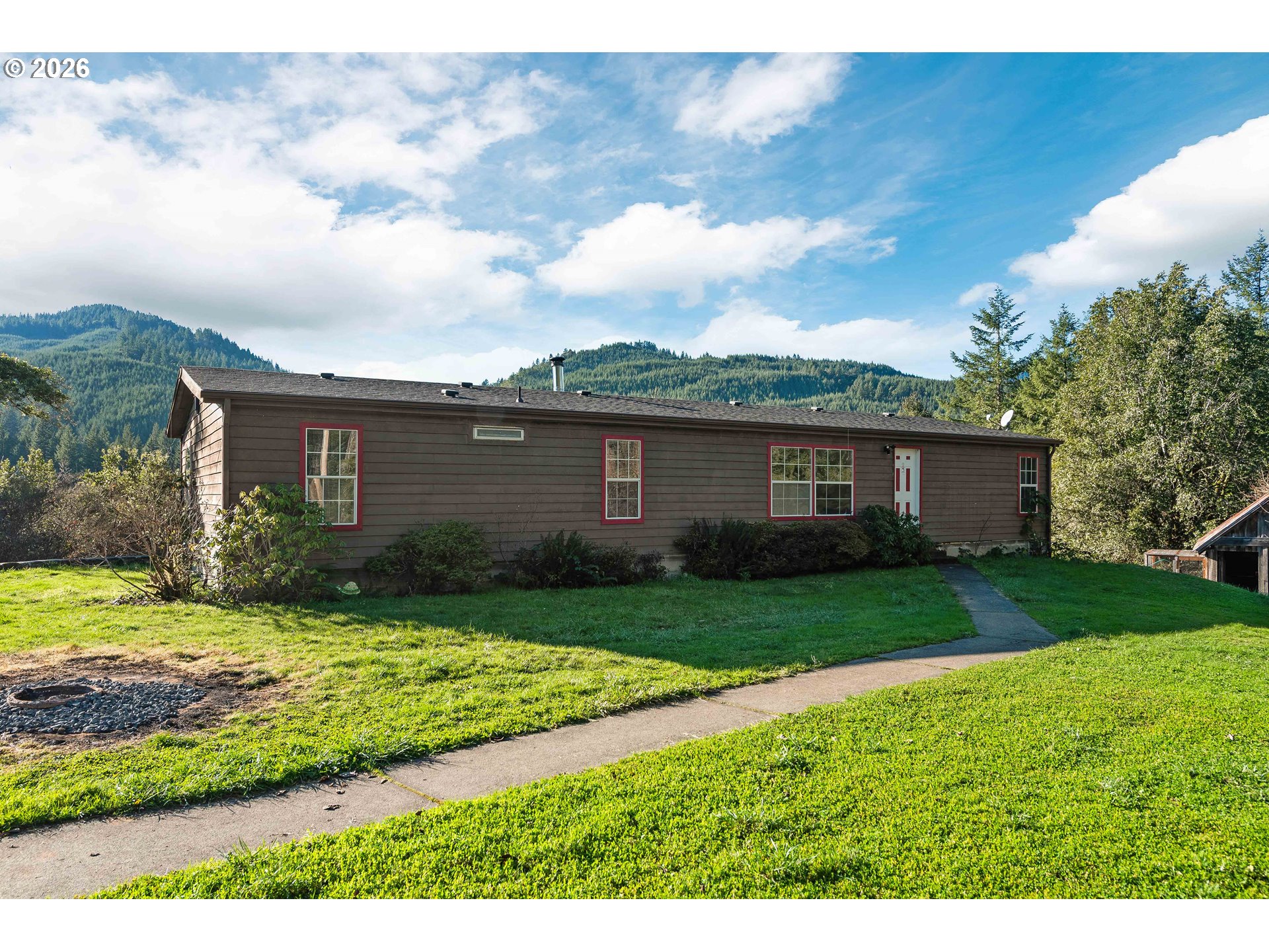 41308 South Powers Road Powers, OR 97466 - Photo 29 of 42 a view of a yard in front of a house