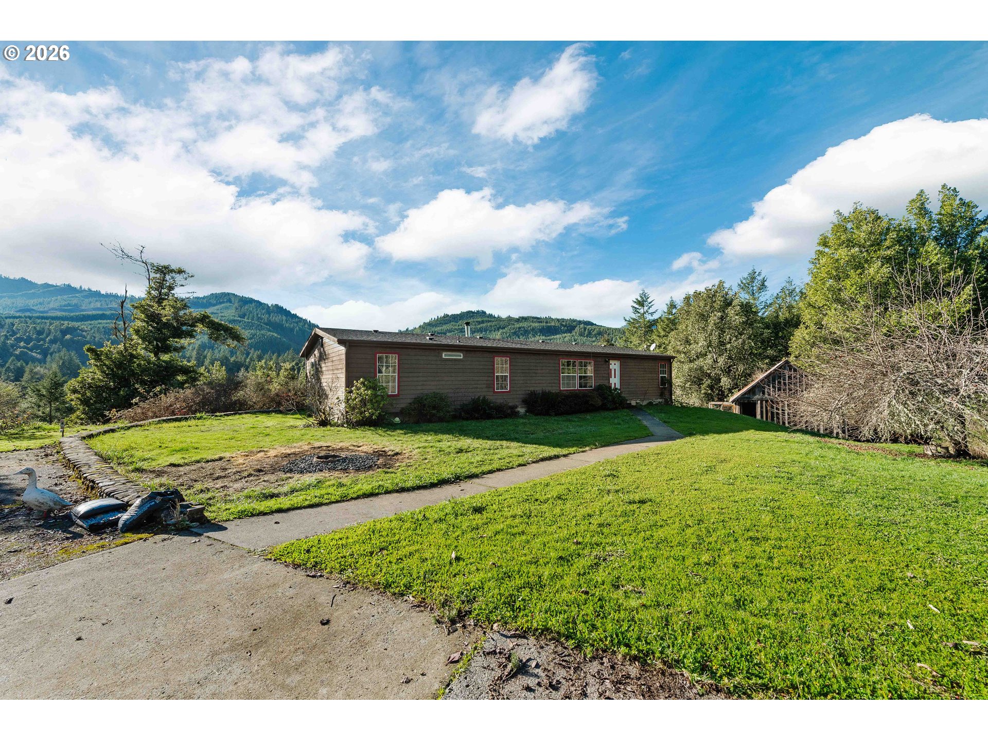 41308 South Powers Road Powers, OR 97466 - Photo 30 of 42 a view of a house with a yard