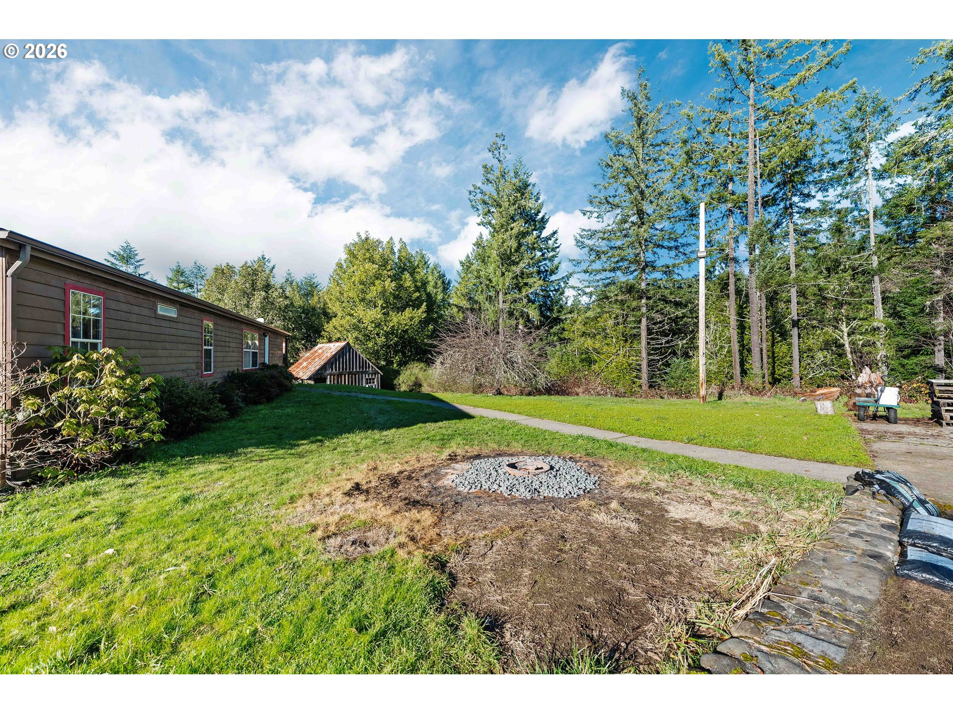 41308 South Powers Road Powers, OR 97466 - Photo 31 of 42 a view of a house with a big yard