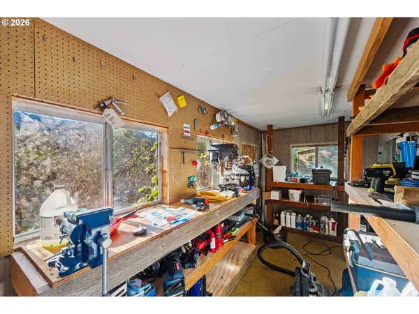 a room with lots of furniture and a large window