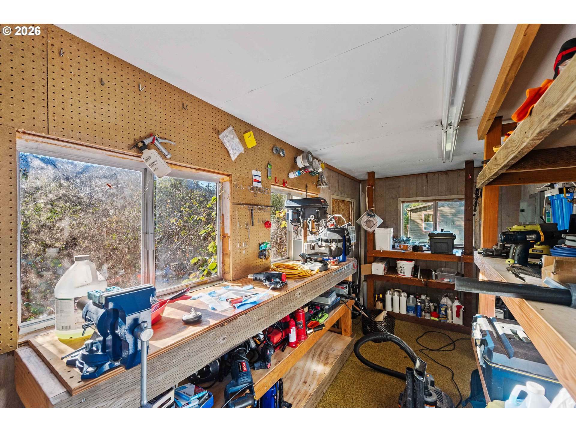 41308 South Powers Road Powers, OR 97466 - Photo 35 of 42 a room with lots of furniture and a large window