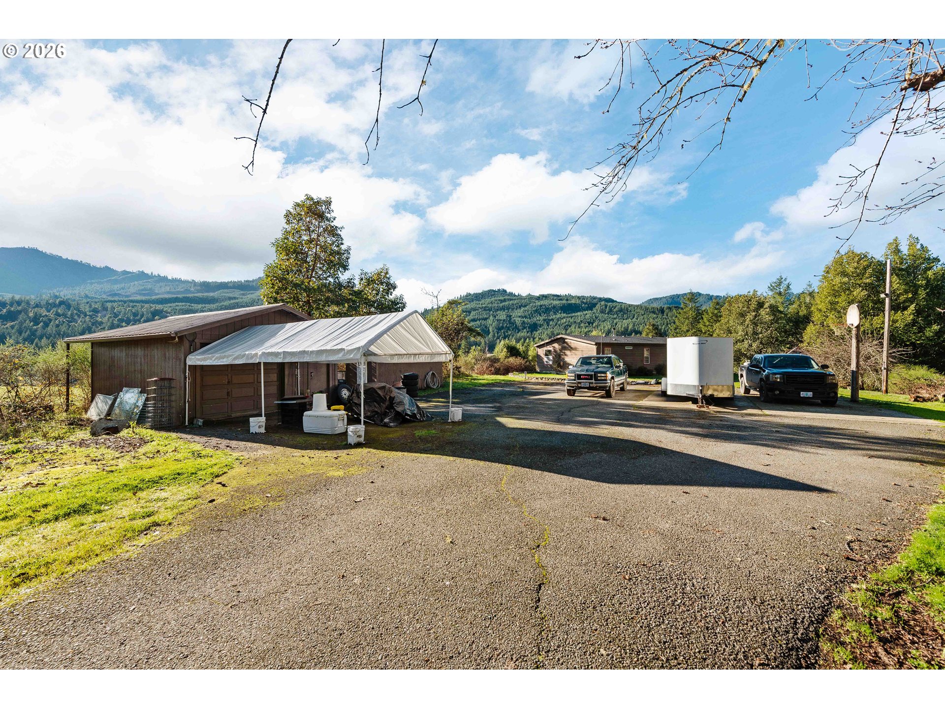 41308 South Powers Road Powers, OR 97466 - Photo 36 of 42 a view of a house with a patio