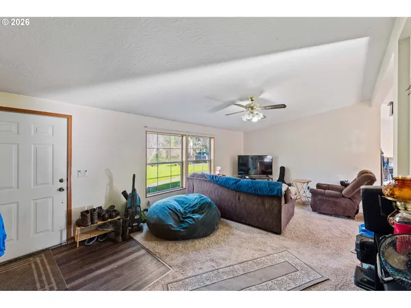 a bedroom with furniture and a window