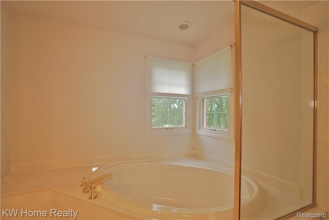 4321 Blood Road Metamora, MI 48455 - Photo 38 of 92 MBR soaking tub after a long day! Fully tiled stall shower next to soaking tub.
