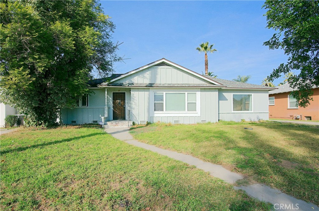 2427 Rancho Drive Riverside, CA 92507 - Photo 1 of 1 a front view of a house with a yard and garage