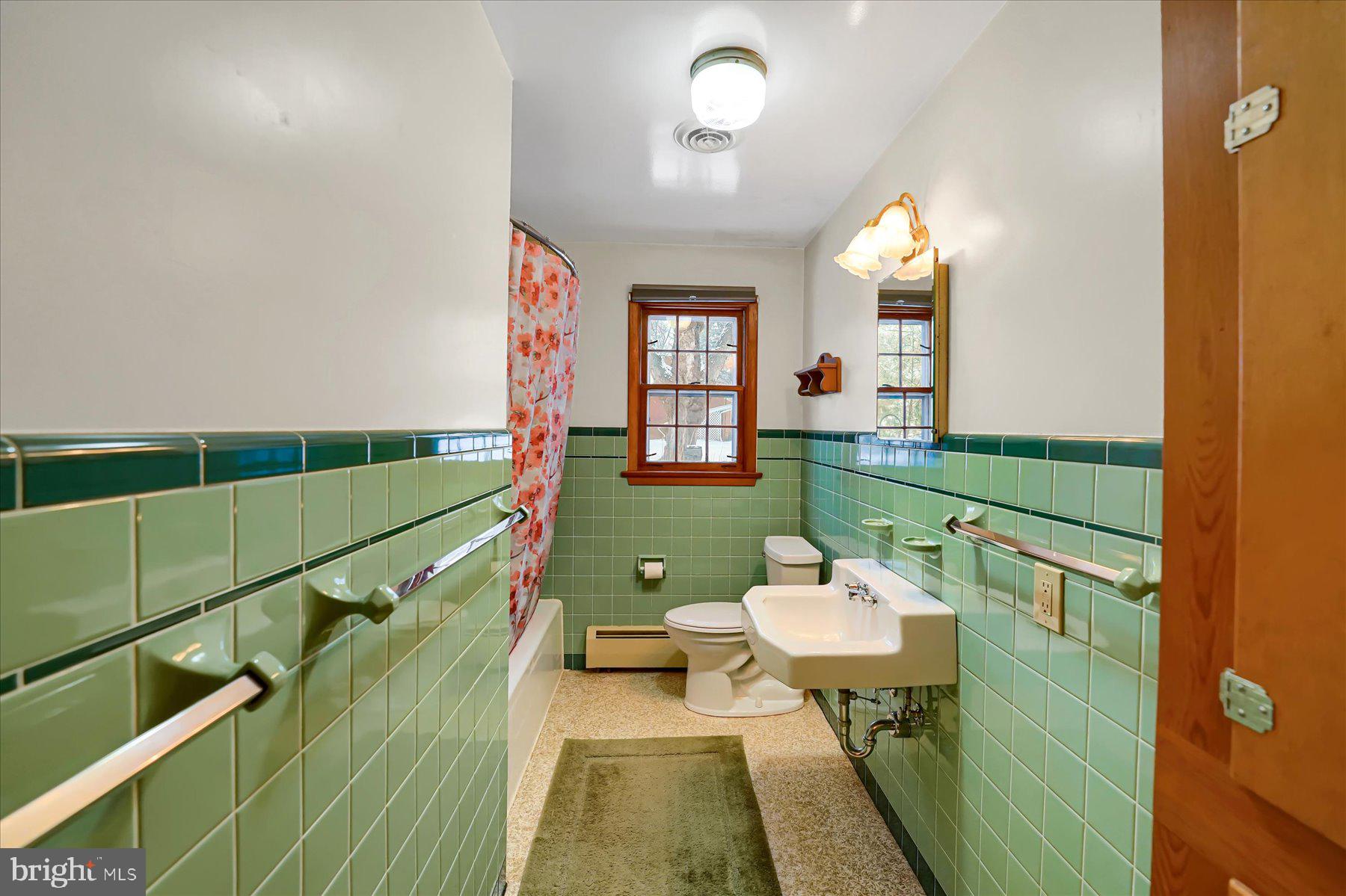 1105 Outer Drive State College, PA 16801 - Photo 23 of 44 a bathroom with a sink mirror and a bath tub