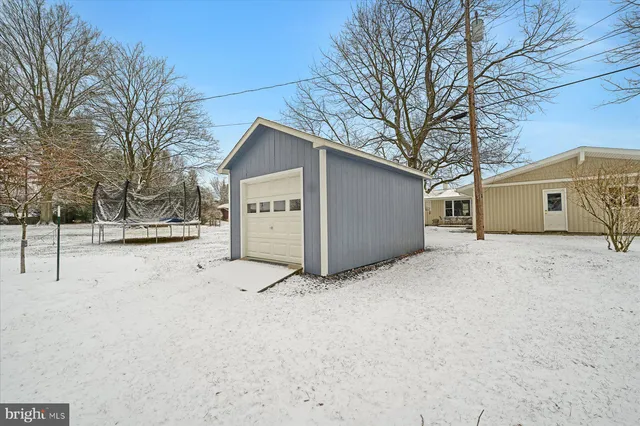 a view of a house with a snow in the yard