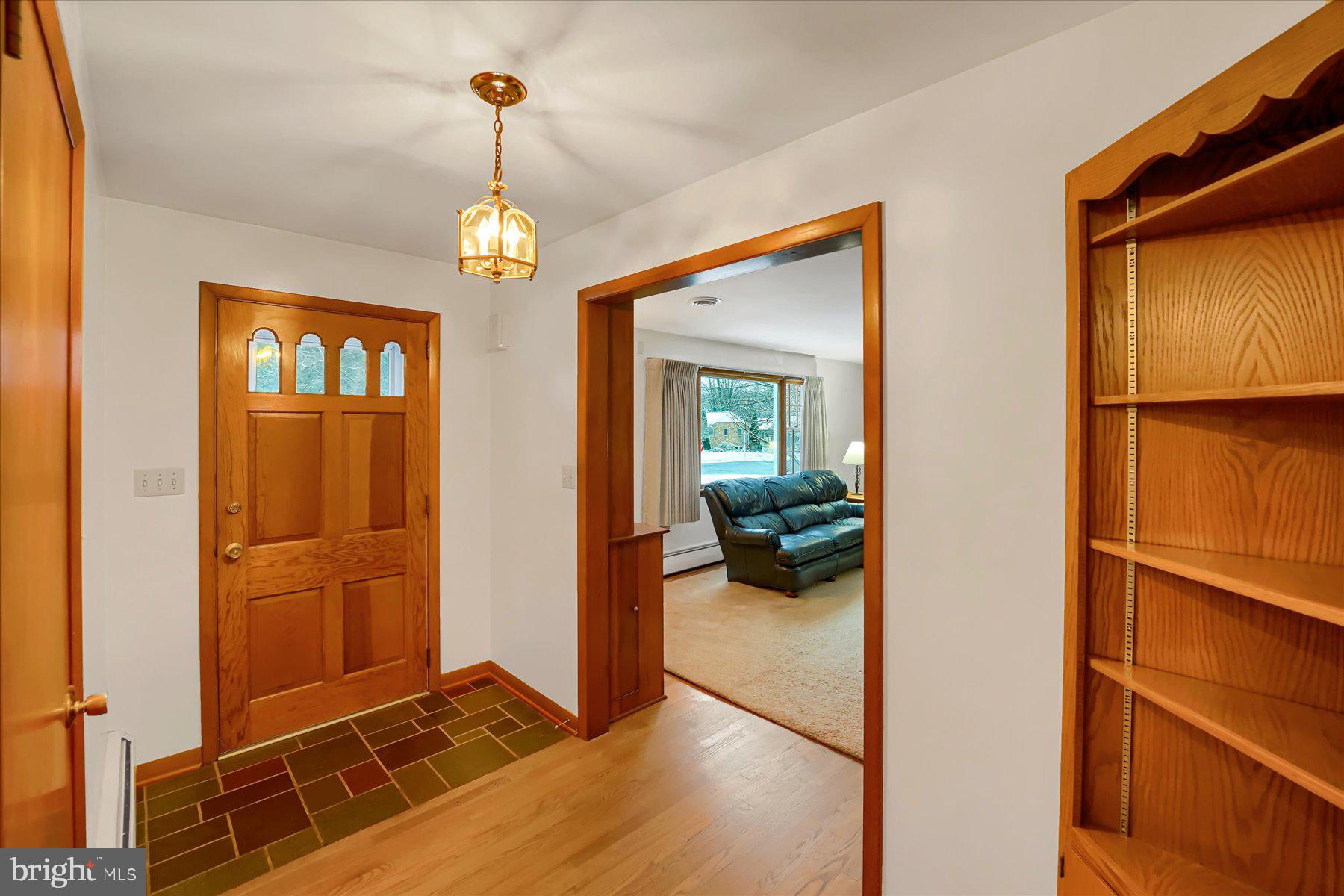 1105 Outer Drive State College, PA 16801 - Photo 6 of 44 a view of a livingroom with furniture entryway and wooden floor