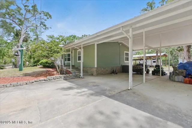 a view of a house with porch and furniture