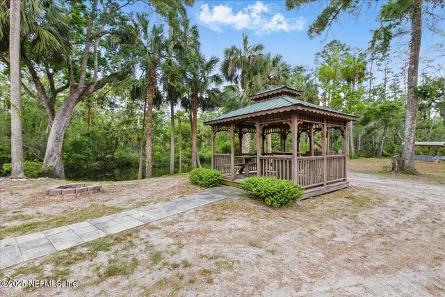 a backyard of a house with a garden and plants
