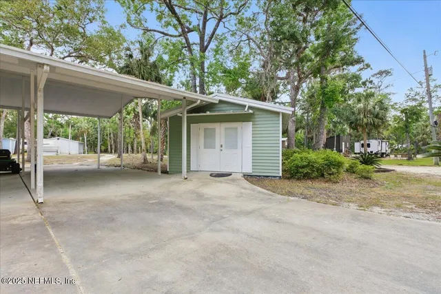 a view of a house with wooden deck
